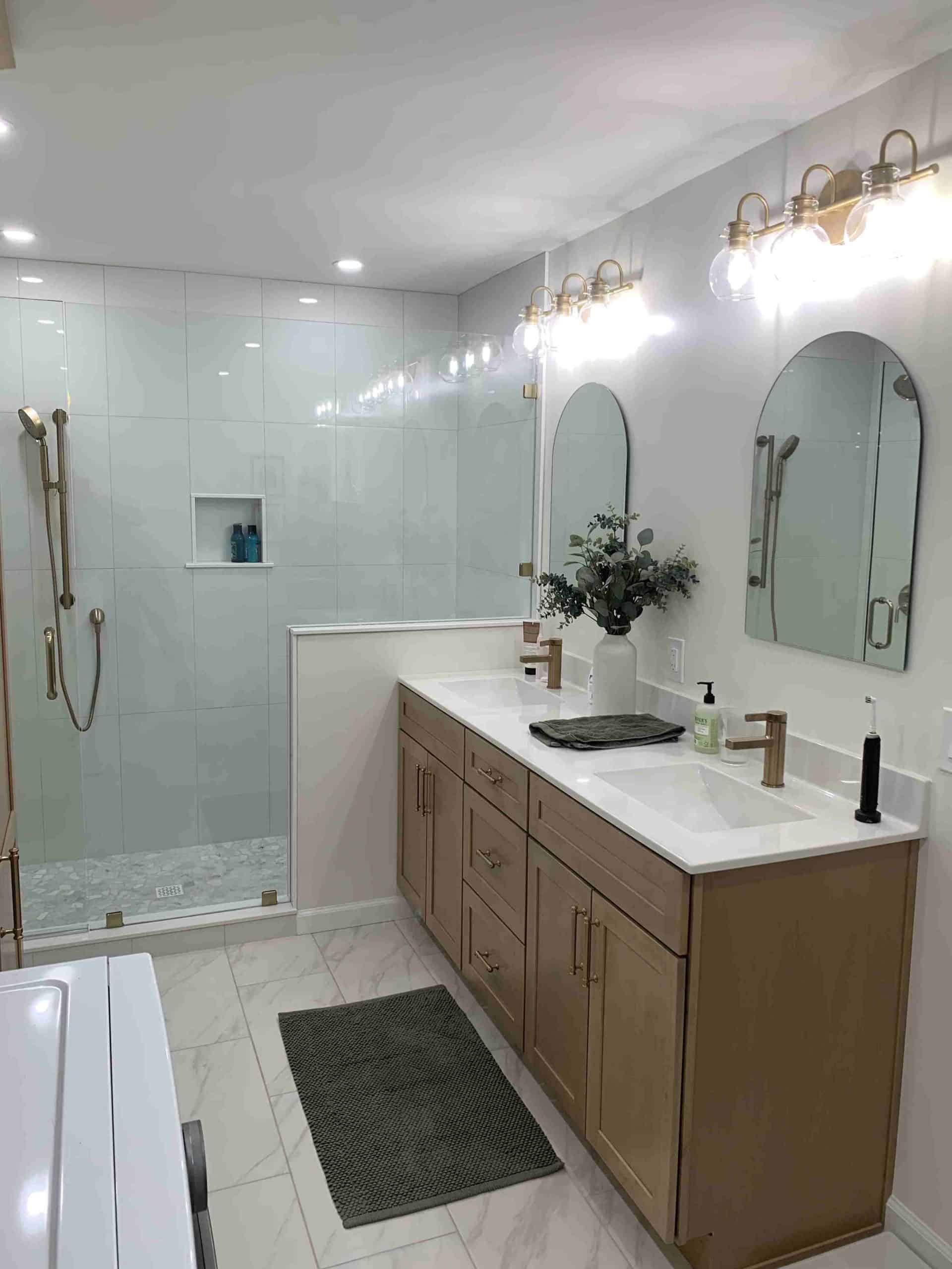 Spacious bathroom remodel with double vanity and glass walk-in shower