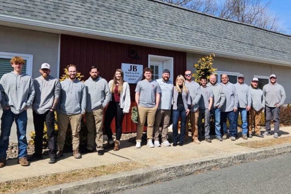 Team Photo With The Building New